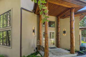 Entrance to property featuring stucco siding