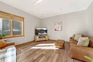 Living area with light wood-type flooring and baseboards