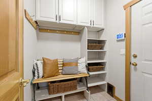Mudroom featuring light tile patterned floors