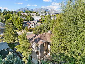 Aerial perspective of suburban area with a mountainous background