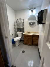 Bathroom in shed featuring concrete floors, and vanity