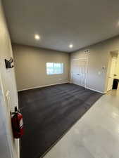 Unfurnished living room with recessed lighting and carpet flooring