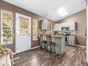 Kitchen with level 3 granite counter tops
