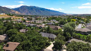Aerial view of residential area featuring a mountainous background