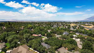 Aerial perspective of suburban area with a mountainous background
