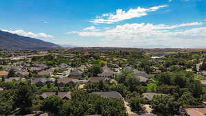 Aerial view of residential area featuring a mountain backdrop