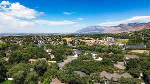 Aerial perspective of suburban area with a mountainous background