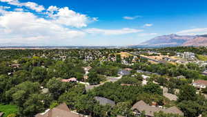 Aerial perspective of suburban area featuring a mountain backdrop