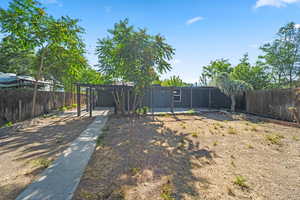 Fenced backyard with a patio