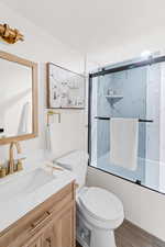 Full bath featuring vanity and wood finished floors