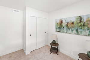 Unfurnished room featuring baseboards and carpet