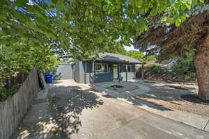 Bungalow featuring covered porch and concrete driveway