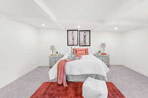 Carpeted bedroom with recessed lighting, beam ceiling, and coffered ceiling