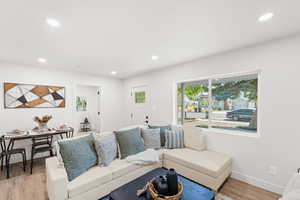 Living area featuring recessed lighting and light wood finished floors