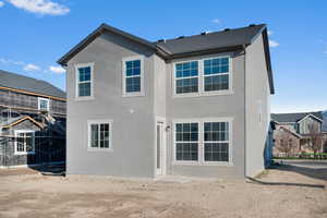 Back of house with stucco siding