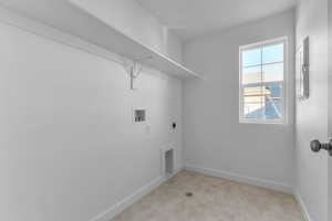 Laundry area featuring hookup for a washing machine and electric dryer hookup