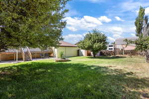 View of yard featuring a patio area and stairs