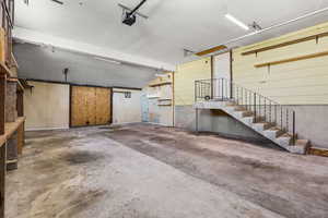 Garage featuring a garage door opener