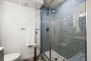 Full bathroom with vanity and a stall shower