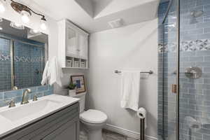 Bathroom with a stall shower and vanity