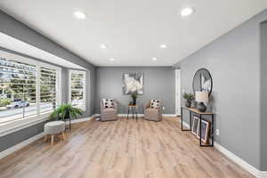 Sitting room featuring light wood finished floors and recessed lighting