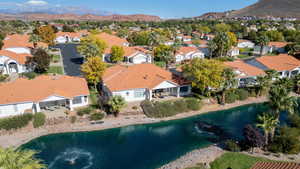 Aerial perspective of suburban area featuring a water and mountain view