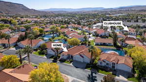 Aerial view of residential area featuring a water and mountain view
