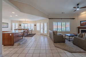 Great Room with light tile patterned floors, a chandelier, french doors, recessed lighting, and ceiling fan