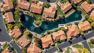 Aerial perspective of suburban area with a nearby body of water