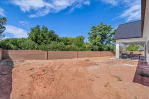 Fenced backyard featuring a patio area