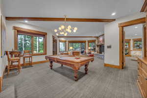 Playroom with beamed ceiling, a fireplace, healthy amount of natural light, pool table, and recessed lighting