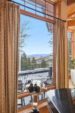 Dining area featuring wood finished floors and a mountain view