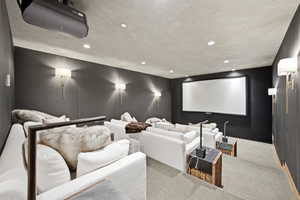 Home theater room featuring carpet flooring and recessed lighting