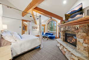 Bedroom with a fireplace, carpet floors, recessed lighting, and ensuite bath