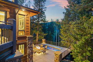 Patio terrace at dusk featuring a fire pit and a patio
