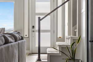 Doorway to outside with tile patterned floors