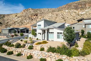 Contemporary house with a mountain view and stucco siding