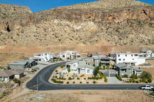 Aerial perspective of suburban area featuring a mountainous background