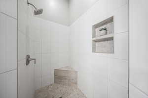Full bathroom with tiled shower