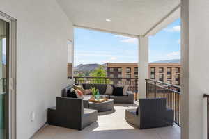 Balcony with a mountain view and an outdoor living space