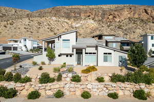 View of front of property featuring stucco siding and a mountain view