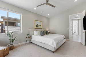 Bedroom with light carpet, recessed lighting, a ceiling fan, and lofted ceiling