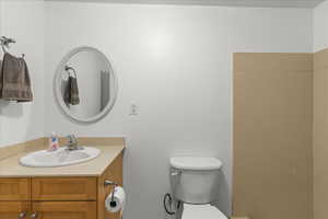 Half bath with vanity and toilet