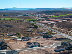 Aerial perspective of suburban area featuring a mountainous background