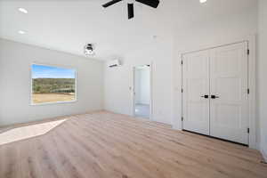 Unfurnished bedroom with recessed lighting, light wood-style floors, ceiling fan, and a closet