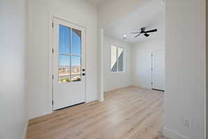 Doorway to outside with wood finished floors, ceiling fan, and recessed lighting