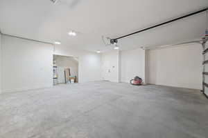 Garage featuring baseboards