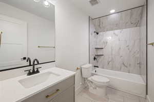 Full bath featuring shower / bathtub combination, vanity, light tile patterned flooring, and recessed lighting