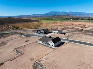 Aerial view of sparsely populated area with a mountainous background