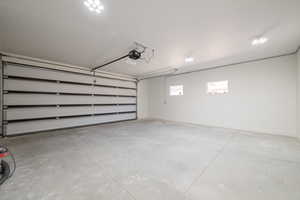 Garage featuring a garage door opener